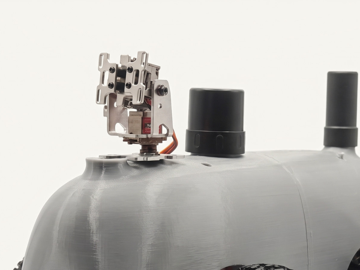 The twin-camera gimbal and sensor pucks on top of the Nano shell.